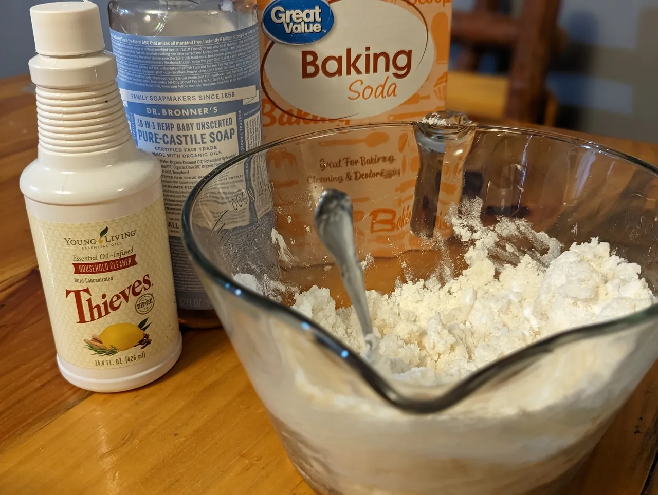 Natural cleaning supplies on table