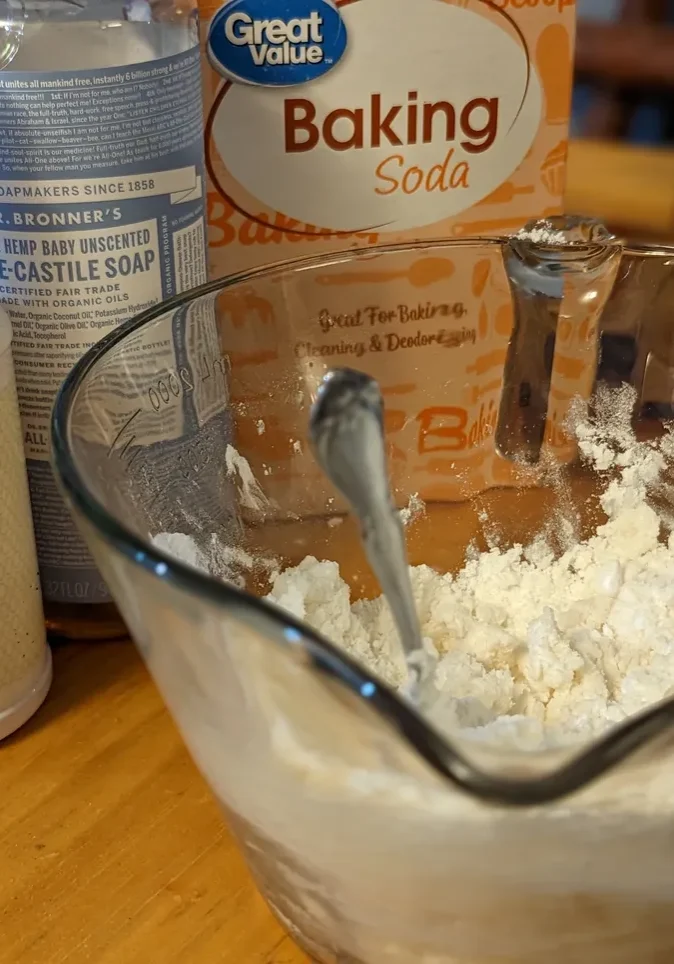 Natural cleaning supplies on table