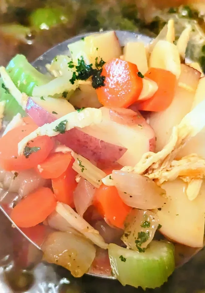 Fresh veggies in hot soup broth